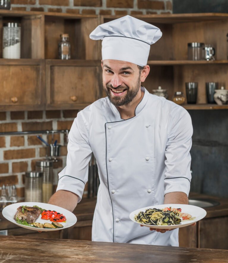 male-cook-standing-kitchen-presenting-delicious-dish